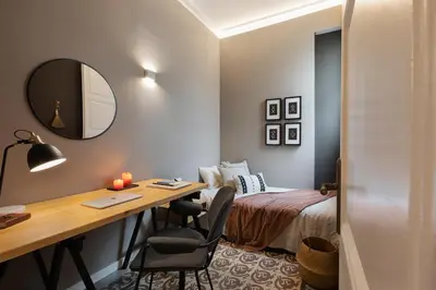 a living room with a couch and a fireplace at Erfoud - 3 bedrooms in Gràcia in Barcelona