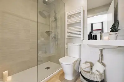 a white bedroom with a bed with a tray on it at Canadell - 2 bedrooms in Sant Antoni in Barcelona