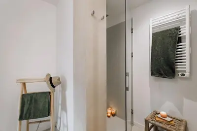 a bedroom with a large bed with two lamps at Alhamilla - 1 bedroom in Eixample Dreta in Barcelona