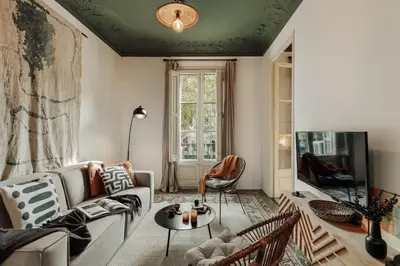 a living room with a couch and a table at Hunde - 2 bedrooms in Eixample Esquerra in Barcelona