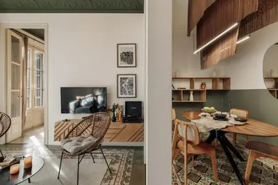 a bedroom with three pictures on the wall and a bed at Hunde - 2 bedrooms in Eixample Esquerra in Barcelona