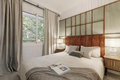 a living room with a table and chairs at Drago - 3 bedrooms and balcony in Les Corts in Barcelona