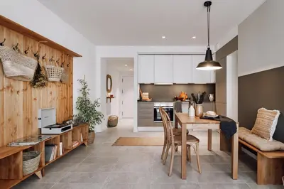 a living room with a table and chairs and a couch at Zubia - 2 bedrooms in Eixample Esquerra in Barcelona