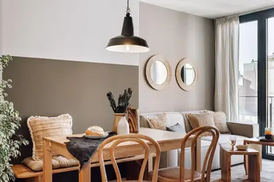 a bedroom with a bed with a wooden headboard at Zubia - 2 bedrooms in Eixample Esquerra in Barcelona