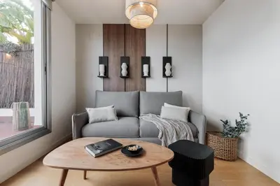 a white bathroom with a sink and a toilet at Tossa - 2 bedroom and terrace in Eixample Esquerra in Barcelona