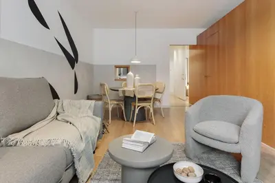 a living room with a couch and a tv at Medes - 2 bedrooms in Sant Gervasi in Barcelona