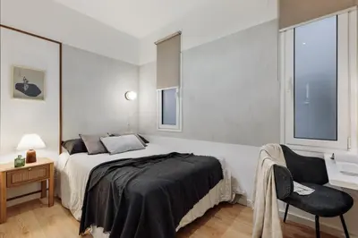 a dining room with a table and chairs at Medes - 2 bedrooms in Sant Gervasi in Barcelona