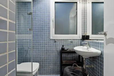 a home office with white cabinets and a desk at Medes - 2 bedrooms in Sant Gervasi in Barcelona