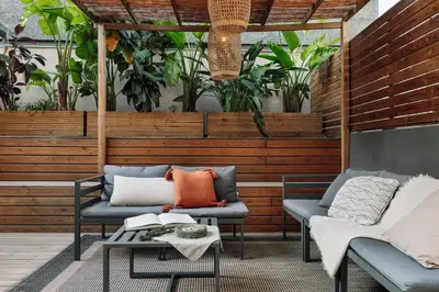 a patio with two chairs and a table at Zuma - 1 bedroom and terrace in Eixample Esquerra in Barcelona