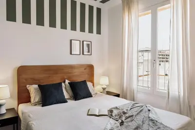 a living room with a couch and a table at Itza - 3 bedrooms and office and terrace in Gràcia in Barcelona