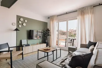 a bedroom with a large bed and a window at Itza - 3 bedrooms and office and terrace in Gràcia in Barcelona