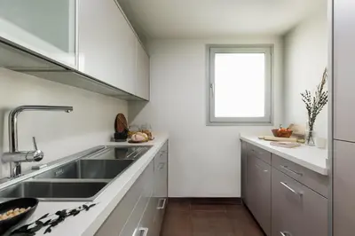 a dining room with a table and chairs at Emporda - 2 bedrooms in Eixample Esquerra in Barcelona