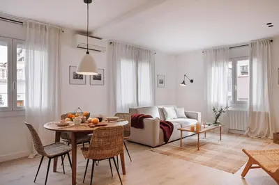 a bedroom with a large bed and a window at Casares - 1 bedroom in Gràcia in Barcelona
