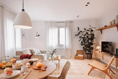 a bedroom with a large bed with two side tables at Casares - 1 bedroom in Gràcia in Barcelona
