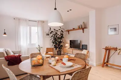 a living room with a table and a couch at Casares - 1 bedroom in Gràcia in Barcelona