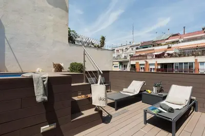 a bedroom with a bed with a tray of food on it at Lys - 2 bedrooms and pool in Eixample Esquerra in Barcelona