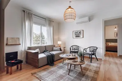 a living room with a couch and a table at Castellar - 2 bedrooms in Eixample Dreta in Barcelona