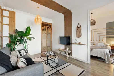 a living room with a couch and a table at Kalo - 1 bedroom and office in Eixample Esquerra in Barcelona