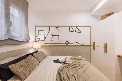 a hallway leading to a bedroom with a bed at Cerler - 2 bedrooms and terrace in Sant Antoni in Barcelona