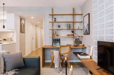 a kitchen and living room with a table and chairs at Cerler - 2 bedrooms and terrace in Sant Antoni in Barcelona