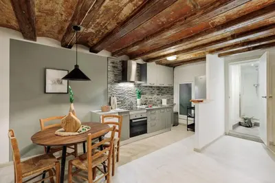 a living room with a couch and a mirror at Sitges - 2 bedrooms in St Pere Sta Caterina i Ribera in Barcelona