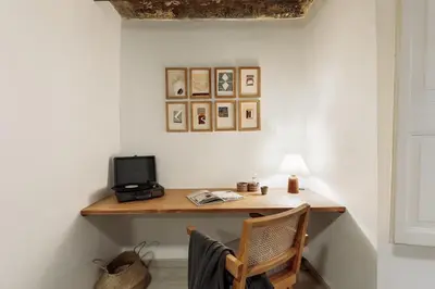 a kitchen and dining room with a brick wall at Sitges - 2 bedrooms in St Pere Sta Caterina i Ribera in Barcelona