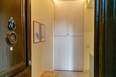 a white refrigerator in a kitchen next to a door at 