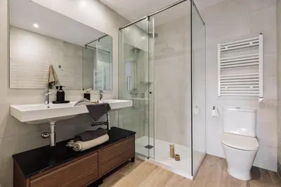 a bedroom with a large bed and a window at Tilapa - 2 bedrooms and terrace in Sant Antoni in Barcelona