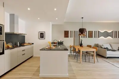 a living room with a couch and a table at Tilapa - 2 bedrooms and terrace in Sant Antoni in Barcelona