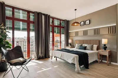 a living room with a couch and a table at Tilapa - 2 bedrooms and terrace in Sant Antoni in Barcelona