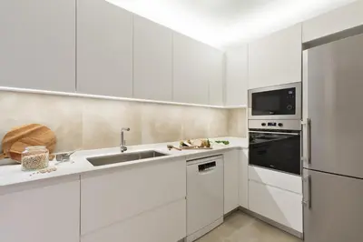 a desk in a room with white cabinets at Torla - 3 bedrooms and terrace in Sant Gervasi in Barcelona