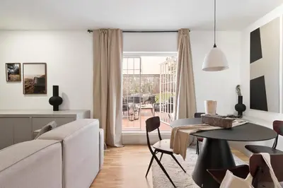 a dining room with a black table and chairs at Torla - 3 bedrooms and terrace in Sant Gervasi in Barcelona