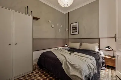 a living room with a couch and a table at Takalik - 4 bedrooms and office in l'Eixample Esq. in Barcelona