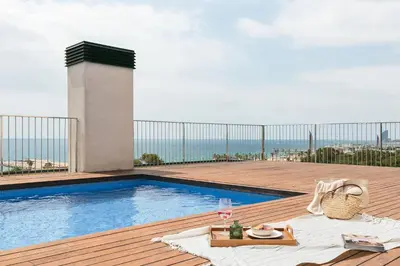 a living room with a couch and a table at Paul - 2 bedrooms and pool in Poblenou in Barcelona