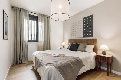 a living room with a table and a couch at Paul - 2 bedrooms and pool in Poblenou in Barcelona