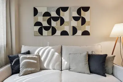 a bedroom with a bed with a book on it at Paul - 2 bedrooms and pool in Poblenou in Barcelona