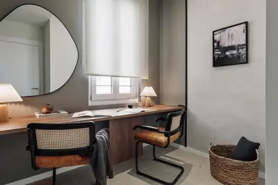 a bedroom with a bed with a tray with two candles on it at Pollock - 2 bedrooms and office in Eixample Dreta in Barcelona