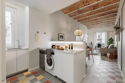 a bedroom with a bed and a window at Pollock - 2 bedrooms and office in Eixample Dreta in Barcelona