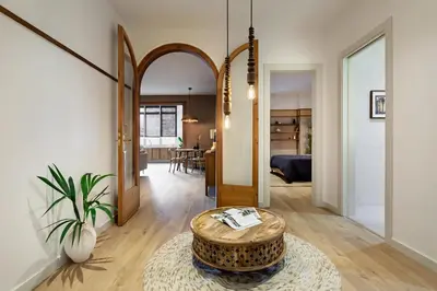 an office with a desk with a computer and a plant at Padar - 2 bedrooms in Eixample Dreta in Barcelona