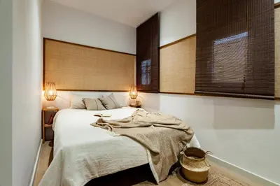 a kitchen with a wooden table and chairs at Padar - 2 bedrooms in Eixample Dreta in Barcelona