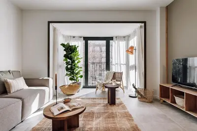 a kitchen with a table with chairs and a dining room at Aldeire - 2 bedrooms, office in Eixample Esquerra in Barcelona