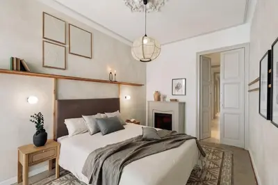 a bedroom with a bed and a fireplace at Lluna - 2 Bedrooms and office in Gracia in Barcelona