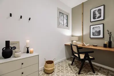 a hallway with a window and a tiled floor at Lluna - 2 Bedrooms and office in Gracia in Barcelona