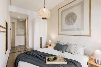 a living room with a couch and a tv at Lluna - 2 Bedrooms and office in Gracia in Barcelona