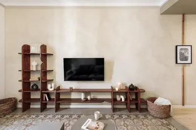 a bedroom with a large bed and a fireplace at Lluna - 2 Bedrooms and office in Gracia in Barcelona
