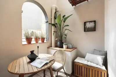 a kitchen with a table and a dining room at Aleu - 2 bedrooms and balcony in Sagrada Família in Barcelona