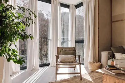 a living room with a couch and a table at Nivar - 2 bedrooms in Eixample Esquerra in Barcelona