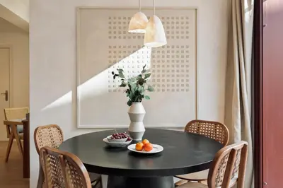 a living room with a gray couch and a tv at Velia - 2 bedrooms and terrace in Ciutat Vella in Barcelona
