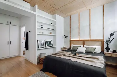 a kitchen with white cabinets and a large window at Aribe - 3 bedroom and terrace in Eixample Esquerra in Barcelona