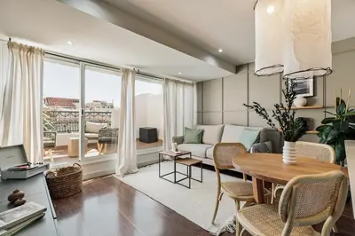 a bedroom with a bed and a desk and a window at Neu - 2 bedrooms and terrace in Eixample Esquerra in Barcelona